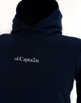 Your weekend just got a little better. Meet the Oi Captain Seas The Day classic fit hoodie.  Created from a cotton blend for instant comfy weekend vibes, crossover hood opening with rib trim applied to edge. Double-needle stitching at shoulder, neck, waistband & cuffs, and a handy kangaroo pocket. Quality vinyl heat pressed Oi Captain logo on front chest and Anchor, latitude and longitude graphic on back.