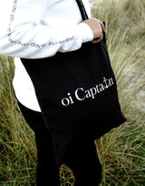 Limited Edition Organic Cotton Canvas Oi Captain Tote Bag is perfect for weekends to everyday.   Quality vinyl heat pressed Oi Captain logo on front and graphic type "Love the life you live and treat everyday like it's a weekend" on handle.  It is your ideal piece to wear any season, durable, sturdy, wonderful and fashionable way to carry things around.