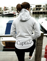 Elevate your casual weekend collection with the Carpe Diem Soft Essentials Hoodie. For all day comfort, this will be your go to.  Features trendy curved back, comfortable cotton bonded polar fleece lined hoodie jacket, drop shoulders add to this relaxed fit, and classic finishing touches, like zipped side pockets and piped trimmed edging. Quality vinyl heat pressed Oi Captain logo on front chest and lower back, and Licinia the label coastal collection set 2021 type graphic on sleeve.