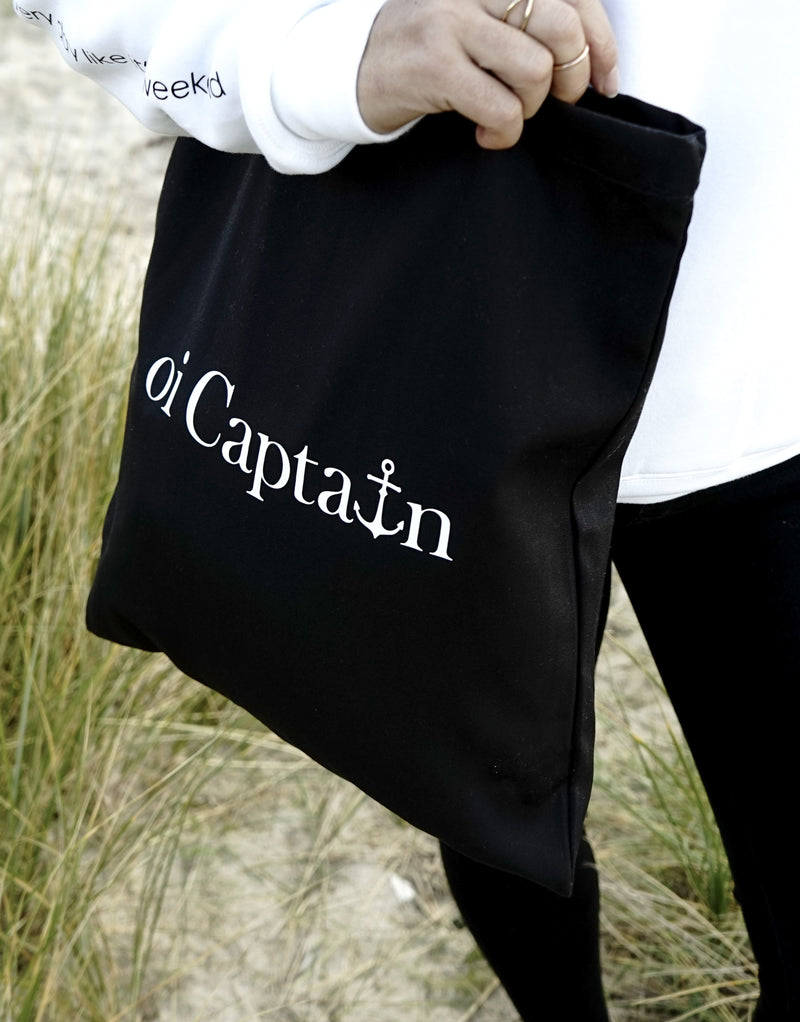 Limited Edition Organic Cotton Canvas Oi Captain Tote Bag is perfect for weekends to everyday.   Quality vinyl heat pressed Oi Captain logo on front and graphic type "Love the life you live and treat everyday like it's a weekend" on handle.  It is your ideal piece to wear any season, durable, sturdy, wonderful and fashionable way to carry things around.