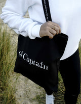 Limited Edition Organic Cotton Canvas Oi Captain Tote Bag is perfect for weekends to everyday.   Quality vinyl heat pressed Oi Captain logo on front and graphic type "Love the life you live and treat everyday like it's a weekend" on handle.  It is your ideal piece to wear any season, durable, sturdy, wonderful and fashionable way to carry things around.